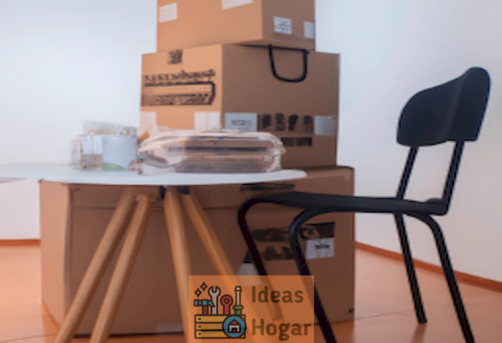 Imagen ilustrativa de una mudanza en un apartamento de una habitación, mostrando cajas de cartón y muebles siendo transportados, representando el costo promedio de mudanza en el año 2024.